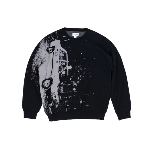 Black sweater with a graphic design of a car on a gray background
