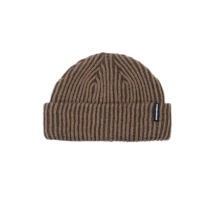 Brown ribbed knit beanie with a brand label on a light gray background
