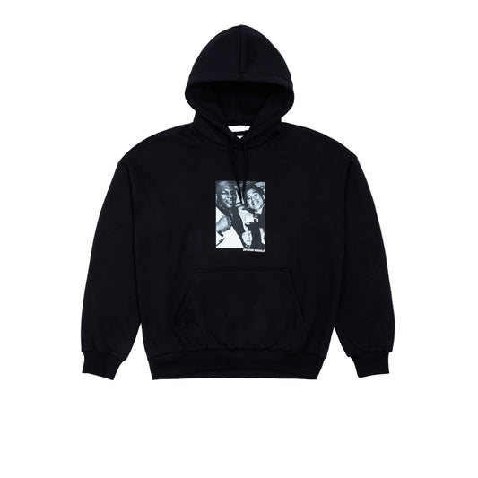 Black hoodie with a graphic design on a light gray background