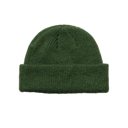 Green knit beanie on a white background